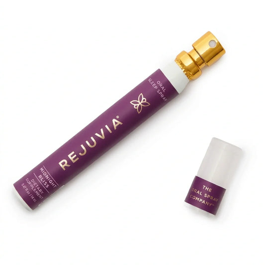 A purple Rejuvia Oral Sleep Spray bottle with a gold atomizer cap, shown next to its detached cap on a clean white background.