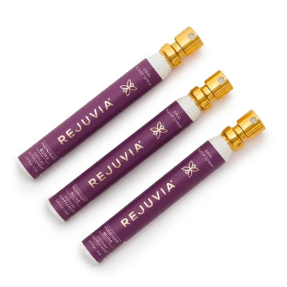 Three Rejuvia Oral Sleep sprays aatomizers arranged diagonally on a clean white background. The spray canisters feature a deep purple label with gold lettering and a metallic gold spray nozzle.